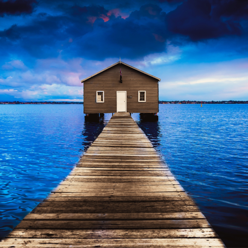 House at end of dock on the water